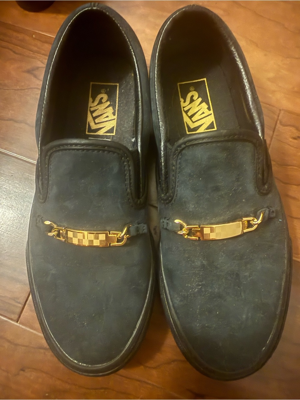 Vans Black Slip-On Loafers with Gold Chain Accent